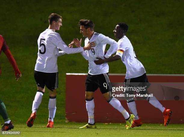 Leon Dajaku of Germany celebrates scoring their first goal during the International Match between Germany U17 and Portugal U17 at St Georges Park on...