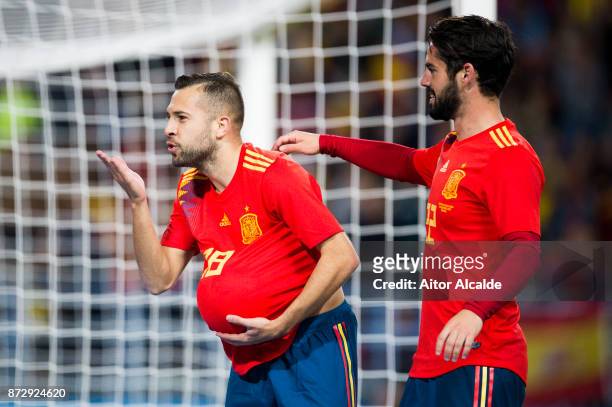 Jordi Alba of Spain celebrates with his teammate Isco Alarcon of Spain after scoring the opening goal during the international friendly match between...