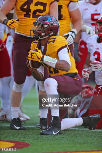 Demry Croft of the Minnesota Golden Gophers carries the ball for a touchdown in the fourth quarter against the Minnesota Golden Gophers at TCF Bank...