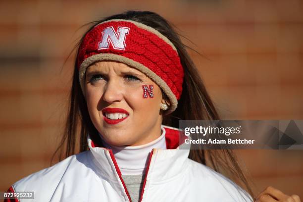 Nebraska Cornhuskers cheerleader watches in the fourth quarter against the Minnesota Golden Gophers at TCF Bank Stadium on November 11, 2017 in...