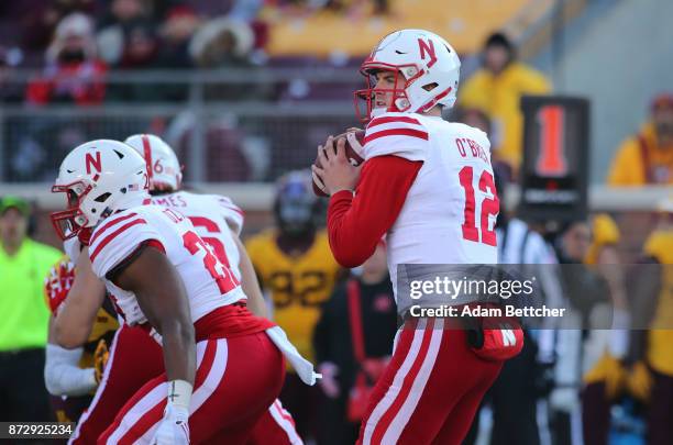 Patrick O'Brien of the Nebraska Cornhuskers takes the snap in the third quarter against the Minnesota Golden Gophers at TCF Bank Stadium on November...