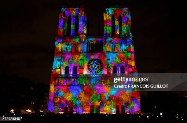 Notre-Dame de Paris Cathedral is illuminated in Paris on November 11 during a light show as part of the Armistice Day commemorations marking the end...