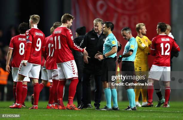 Aage Hareide, Manager of Denmark and Nicklas Bendtner of Denmark shake hands with the referee during the FIFA 2018 World Cup Qualifier Play-Off:...