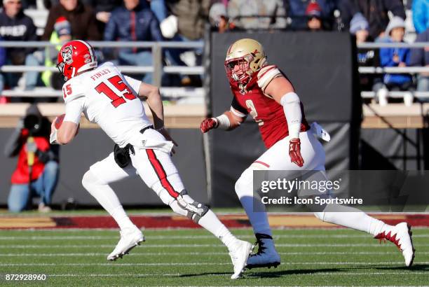 North Carolina State quarterback Ryan Finley chased by Boston College defensive end Zach Allen during a game between the Boston College Eagles and...