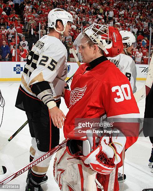 Chris Osgood of the Detroit Red Wings shakes hands with Chris Pronger of the Anaheim Ducks after Game Seven of the Western Conference Semifinal Round...
