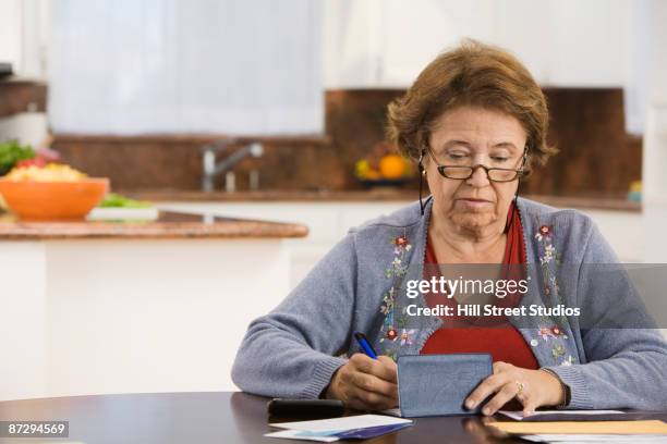 Woman Writecheck 4,460 Woman Writing Checks Stock Photos, High-Res Pictures, and Images ...