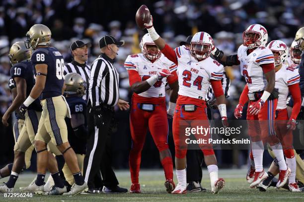 Safety Delano Robinson of the Southern Methodist Mustangs celebrates a recovered fumble against the Navy Midshipmen during the second quarter at...