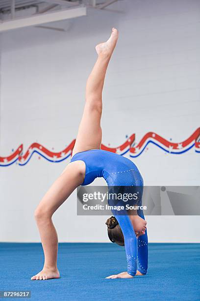 a gymnast doing floor exercises - floor gymnastics stock pictures, royalty-free photos & images