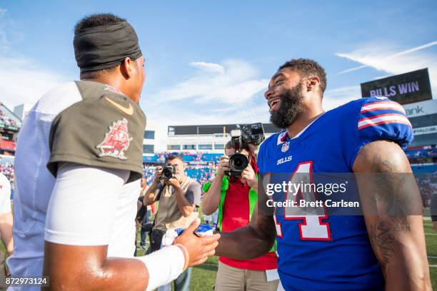 Jameis Winston of the Tampa Bay Buccaneers shakes hands with Joe Webb of the Buffalo Bills after the game at New Era Field on October 22, 2017 in...