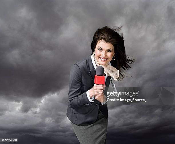 news presenter in storm - television host stock pictures, royalty-free photos & images