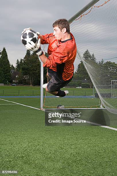 goalkeeper making a save - teenagers only stock pictures, royalty-free photos & images
