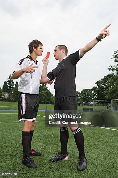 referee giving red card - referee giving red card stock pictures, royalty-free photos & images