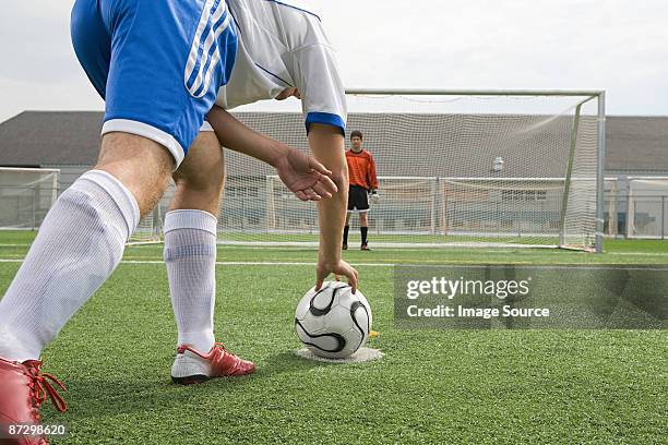 footballer and goalkeeper - posizionare foto e immagini stock