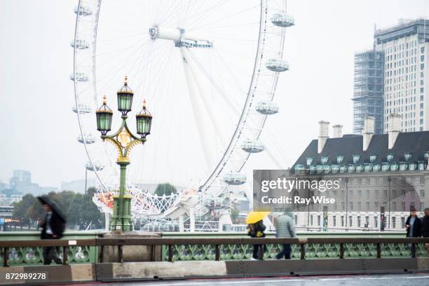 millennium wheel from westminster bridge in the rain - person falls from westminster bridge stock pictures, royalty-free photos & images