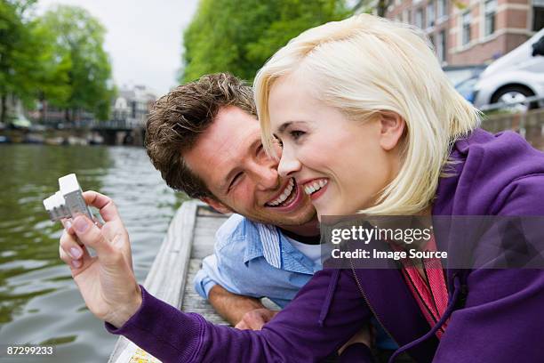 couple by canal - dutch culture stock photos et images de collection