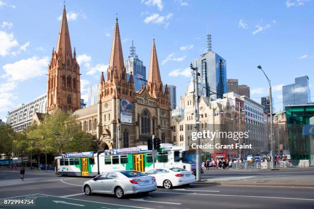 view of city intersection - melbourne traffic stock-fotos und bilder