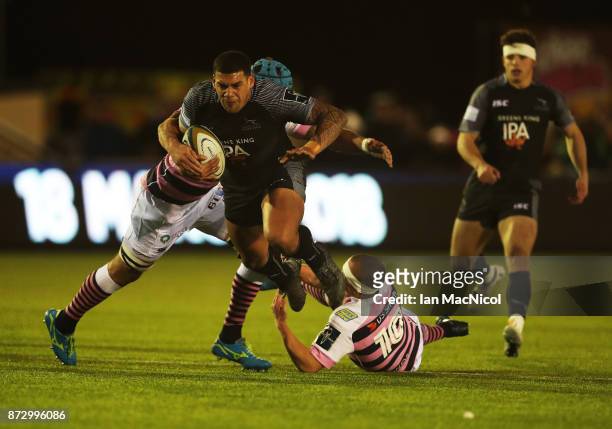 Josh Matavesi of Newcastle Falcons is tackled by Ben White of Cardiff Blues during the Anglo-Welsh Cup match between Newcastle Falcons and Cardiff...
