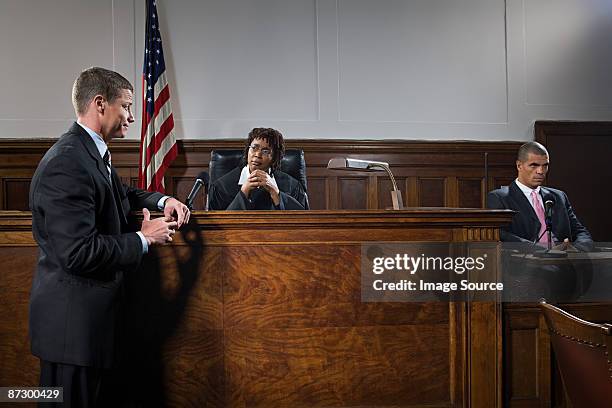 a lawyer and judge talking - judge bench stock pictures, royalty-free photos & images