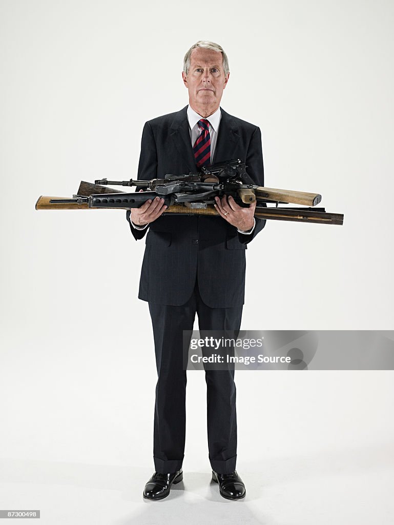 Man holding guns