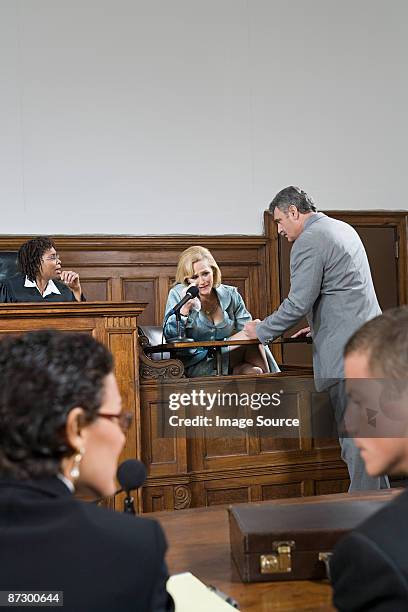 a lawyer questioning a witness - getuige stockfoto's en -beelden