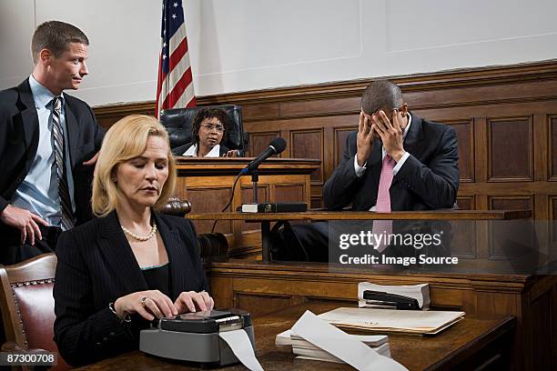 a lawyer questioning a suspect - judge bench stock pictures, royalty-free photos & images