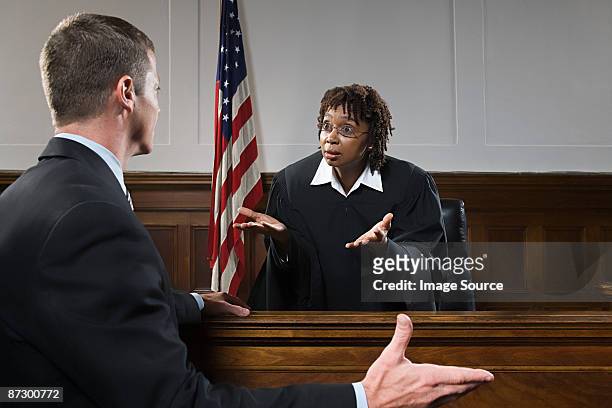 a lawyer and a judge arguing - lawyers arguing stock pictures, royalty-free photos & images