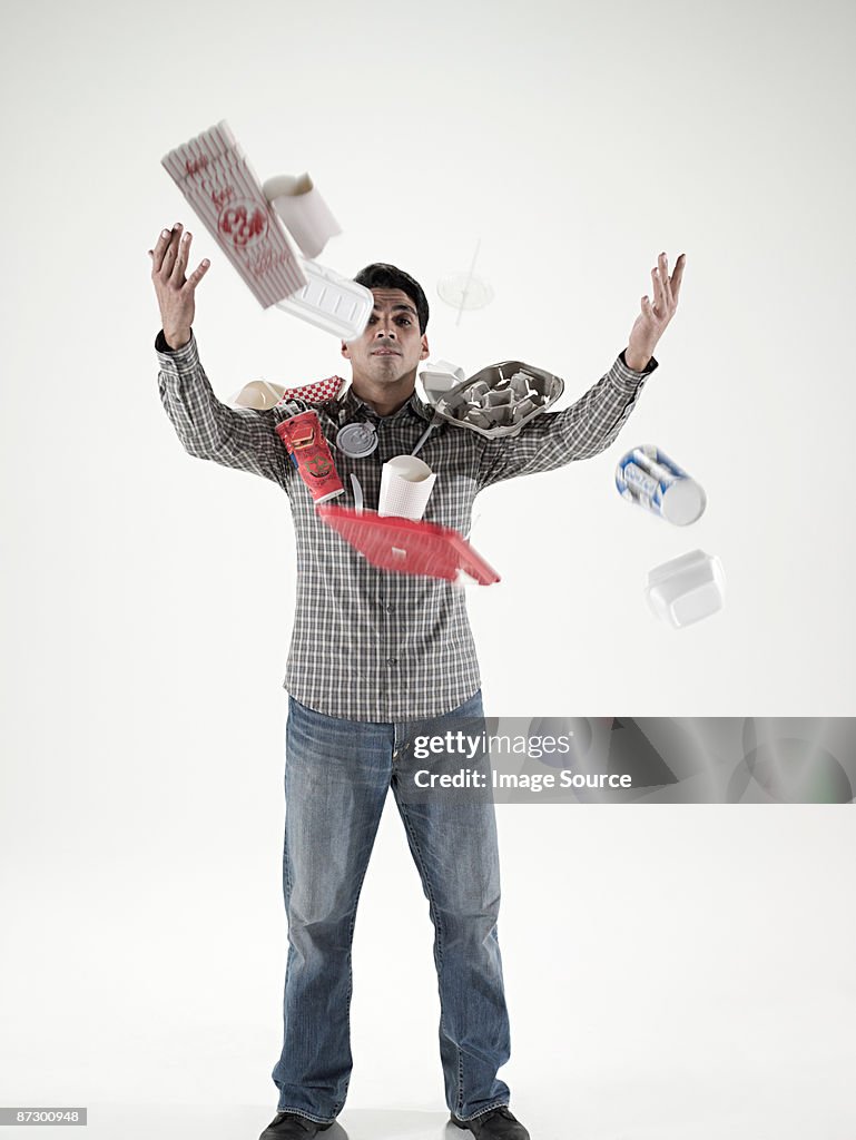 Man throwing fast food packaging