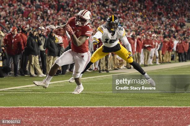Bradrick Shaw of the Wisconsin Badgers avoids a tackle by Joshua Jackson of the Iowa Hawkeyes during the fourth quarter of a game at Camp Randall...