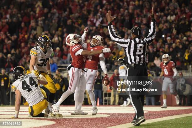 Taylor of the Wisconsin Badgers is congratulated by Kendric Pryor folllowing a touchdown against the Iowa Hawkeyes during the fourth quarter of a...