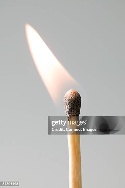 a burning match - streichhölzer stock-fotos und bilder