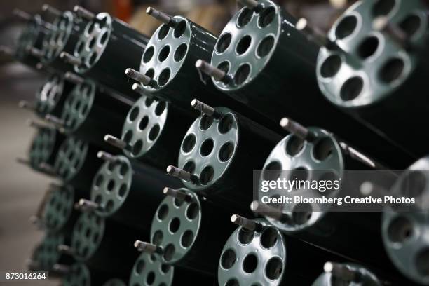 sonar transducer tubes dry on racks at a facility - transducer stock pictures, royalty-free photos & images