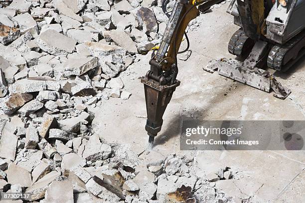 pneumatic drill breaking concrete - presslufthammer stock-fotos und bilder