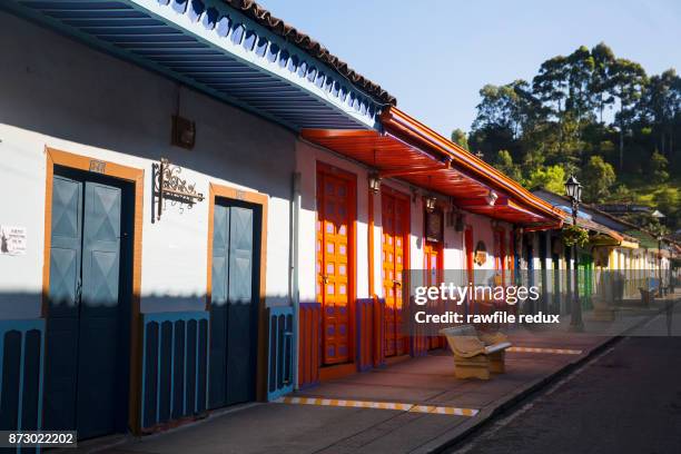 a brightly painted street. - valle de cocora stock pictures, royalty-free photos & images