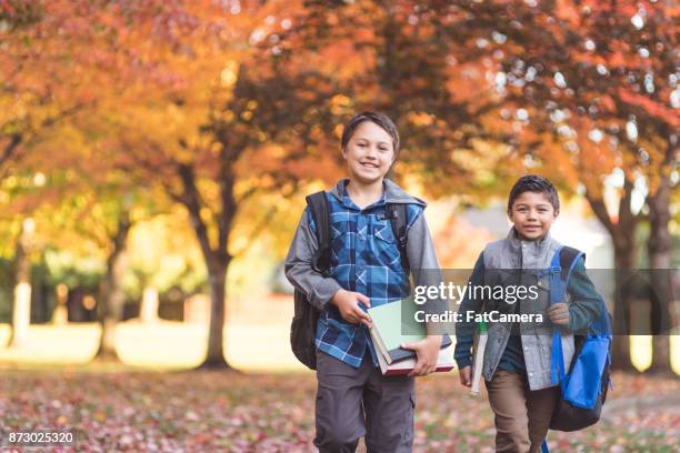 brothers waking to school - november 2 2017 stock pictures, royalty-free photos & images