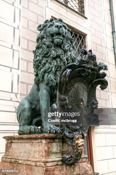 lion statue in front of munich's residenz - munich residenz stock pictures, royalty-free photos & images