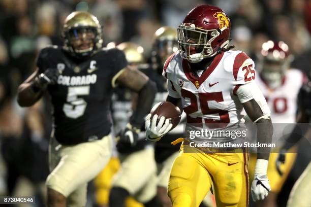 Ronald Jones II of the USC Trojans carries the ball for a touchdown against the Colorado Buffaloes at Folsom Field on November 11, 2017 in Boulder,...