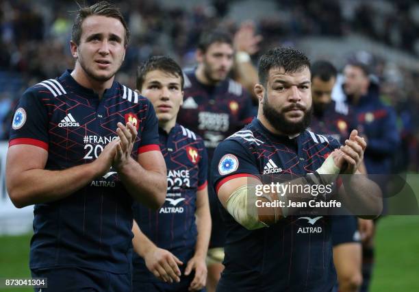 Anthony Jelonchl, Antoine Dupont, Rabah Slimani of France salute the fans following the autumn international rugby match between France and New...