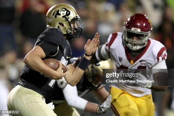 Quarterback Steven Montez of the Colorado Buffaloes caries the ball against the USC Trojans at Folsom Field on November 11, 2017 in Boulder, Colorado.