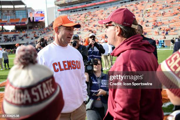 Clemson head coach Dabo Swinney and Florida State Head Coach Jimbo Fisher meet at mid field during pre-game between the Clemson Tigers and the...