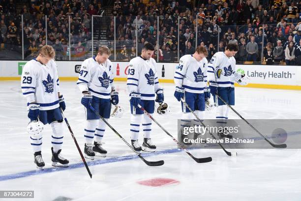 William Nylander, Leo Komarov, Nazem Kadri, Morgan Rielly and Ron Hainsey of the Toronto Maple Leafs stand on the blue lind for the national anthem...