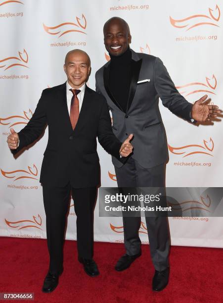 Jimmy Choi and Akbar Gbajabiamila on the red carpet of A Funny Thing Happened On The Way To Cure Parkinson's benefitting The Michael J. Fox...
