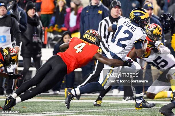 Michigan Wolverines running back Chris Evans runs a for a long gain in the fourth quarter against Maryland Terrapins defensive back Darnell Savage...