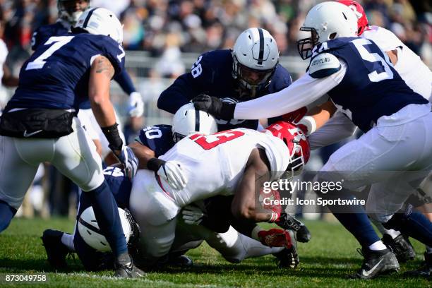 Penn State LB Brandon Smith , LB Jason Cabinda , S Troy Apke , and DT Robert Winsor tackle Rutgers RB Gus Edwards . The Penn State Nittany Lions...