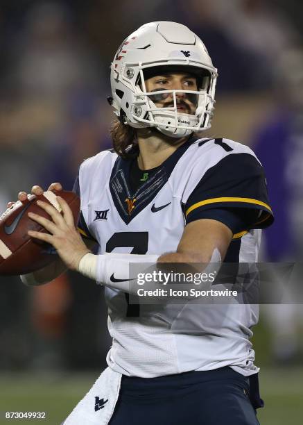 West Virginia Mountaineers quarterback Will Grier passes in the fourth quarter of a Big 12 game between the West Virginia Mountaineers and Kansas...