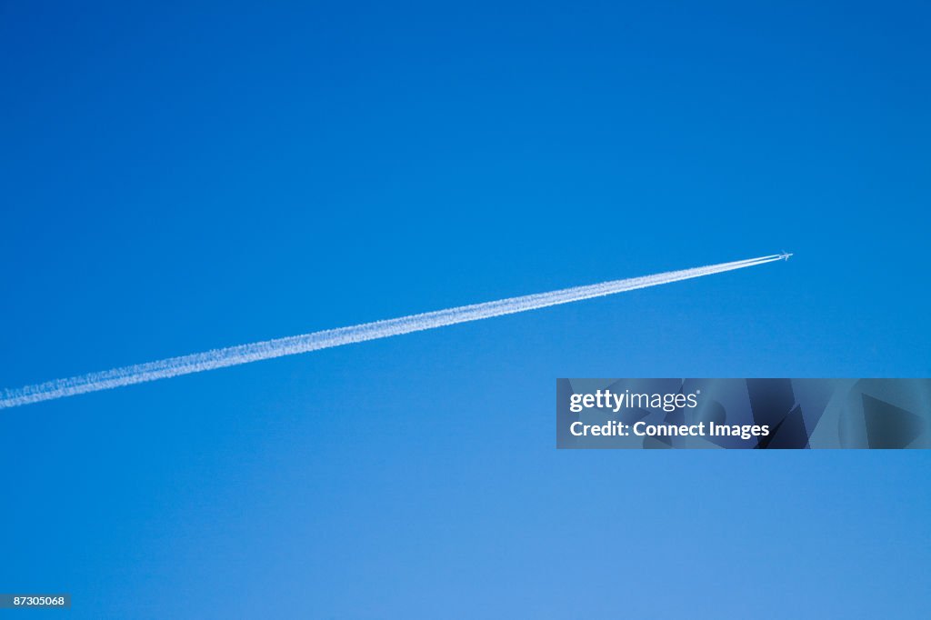 Airplane and vapour trail