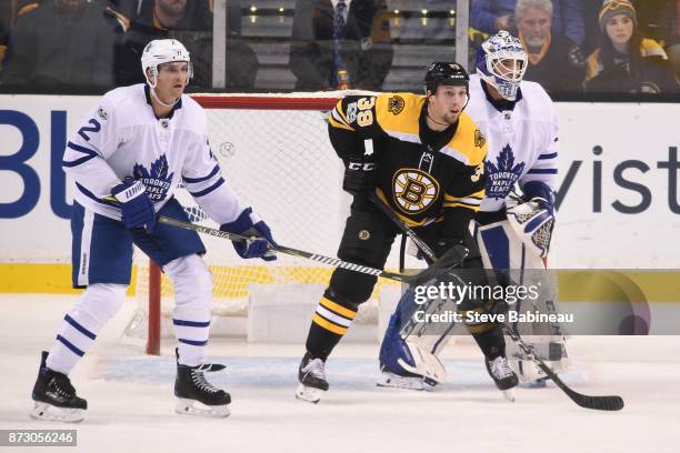 Matt Beleskey of the Boston Bruins watches the play against Ron Hainsey and Curtis McElhinney of the Toronto Maple Leafs at the TD Garden on November...