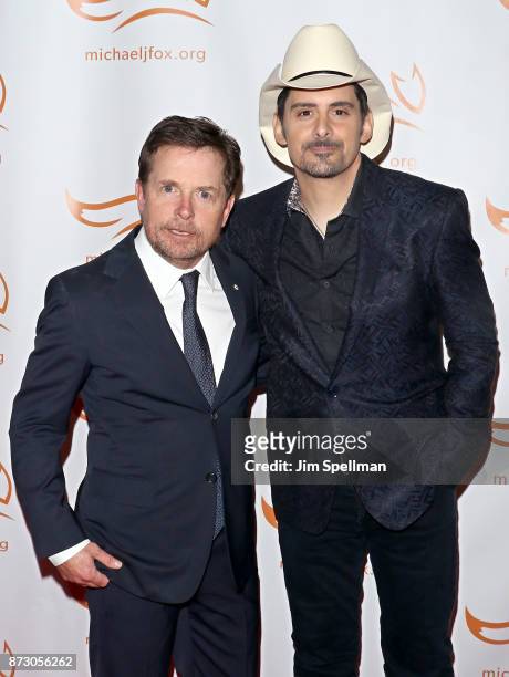 Actor Michael J. Fox and singer/songwriter Brad Paisley attend the 2017 A Funny Thing Happened on the Way to Cure Parkinson's event at the Hilton New...