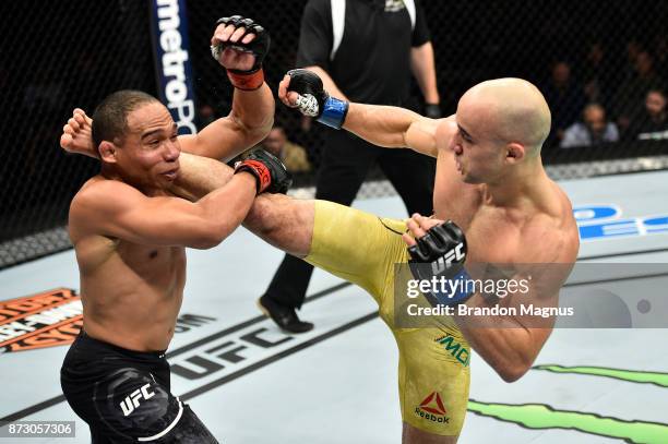 Marlon Moraes of Brazil kicks John Dodson in their bantamweight bout during the UFC Fight Night event inside the Ted Constant Convention Center on...