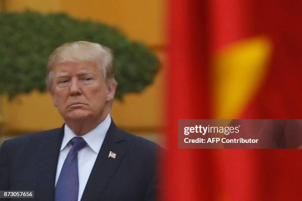 President Donald Trump attends a welcoming ceremony at the Presidential Palace in Hanoi on November 12, 2017. Trump arrived in the Vietnamese capital...