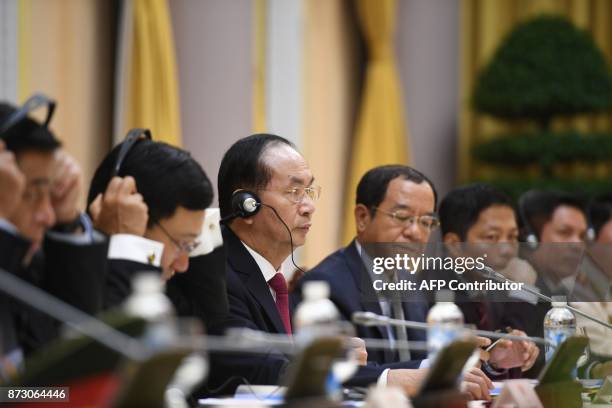 Vietnamese President Tran Dai Quang attends a bilateral meeting with US President Donald Trump at the Presidential Palace in Hanoi on November 12,...